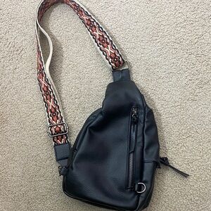 Stylish Black Sling Bag with Patterned Strap